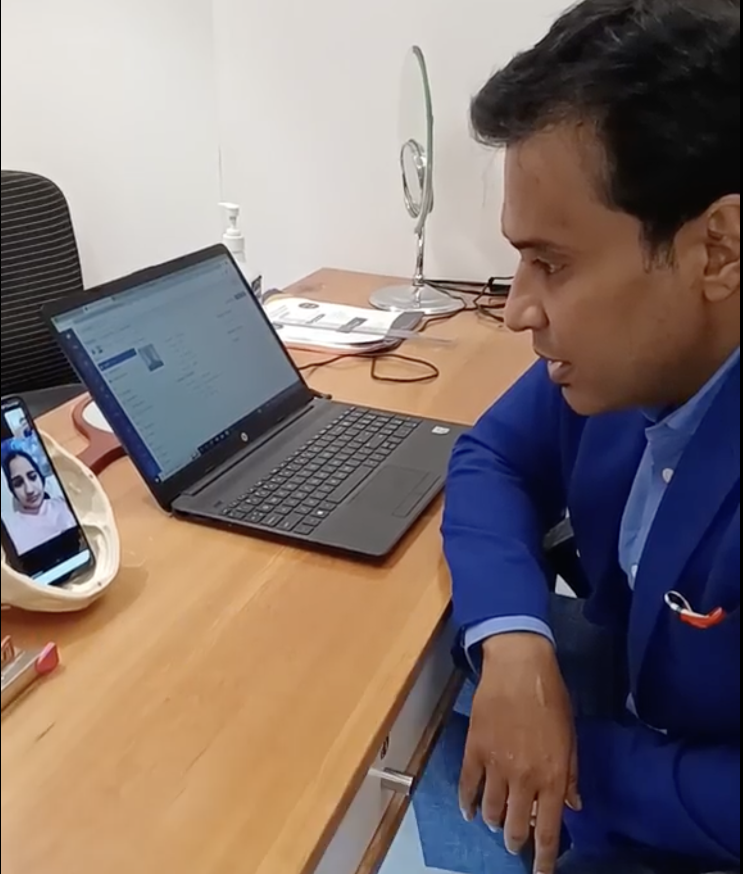 Dr. Debraj Shome conducting virtual consultation with international patient